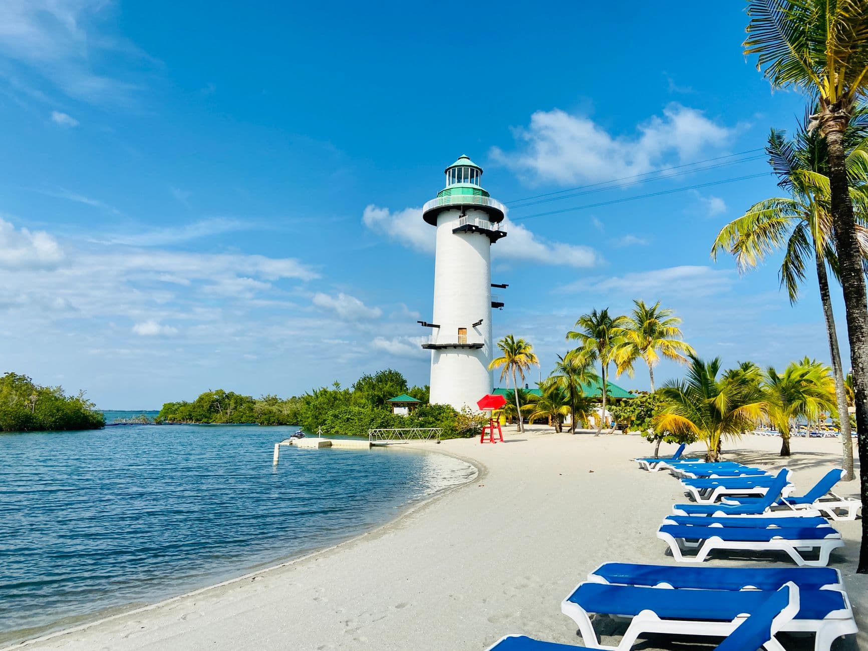 Stock photograph of a beach and lighthouse in Placencia, Belize